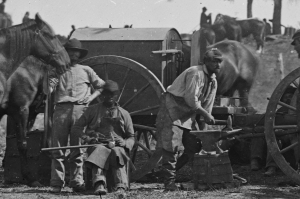 Union army blacksmiths working on a portable forge
